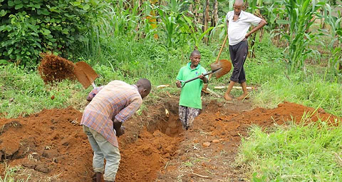 Men breaking ground