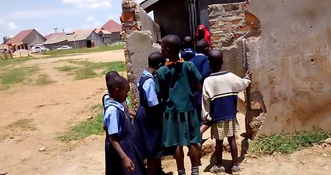 Girls standing in line for latrine