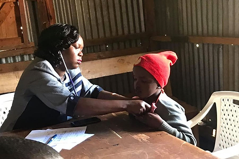 Nurse checking child