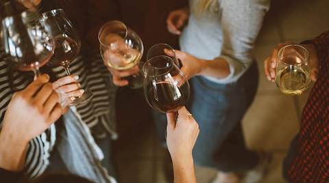 Friends drinking wine together