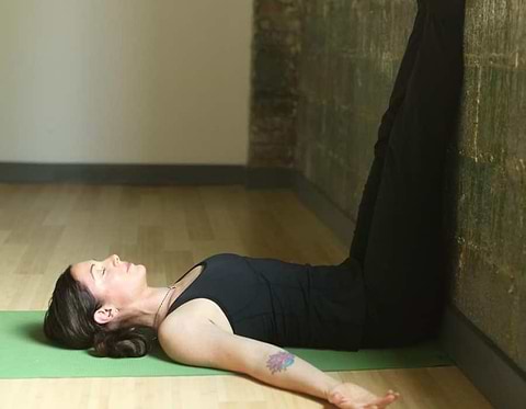 Person in inverted leg pose