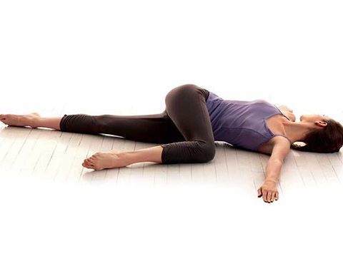 Woman in Supine Twist Pose
