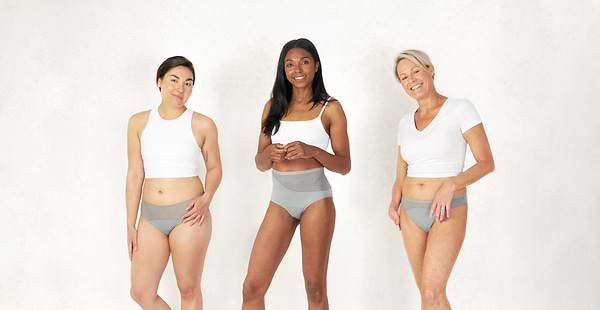 Three models wearing Saalt period underwear in Pebble Grey color.