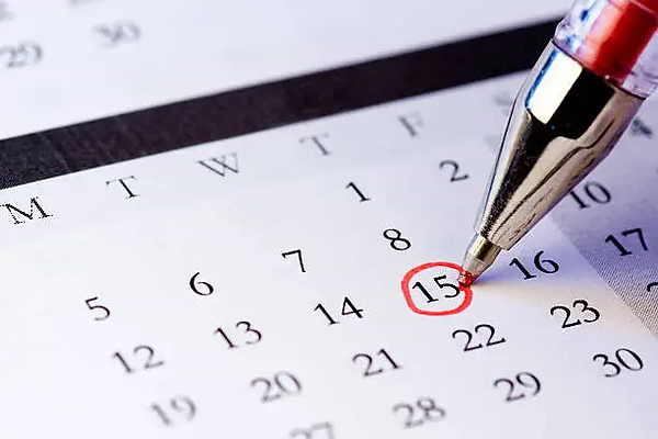 Calendar Showing A Pen Circling A Date To Track Period