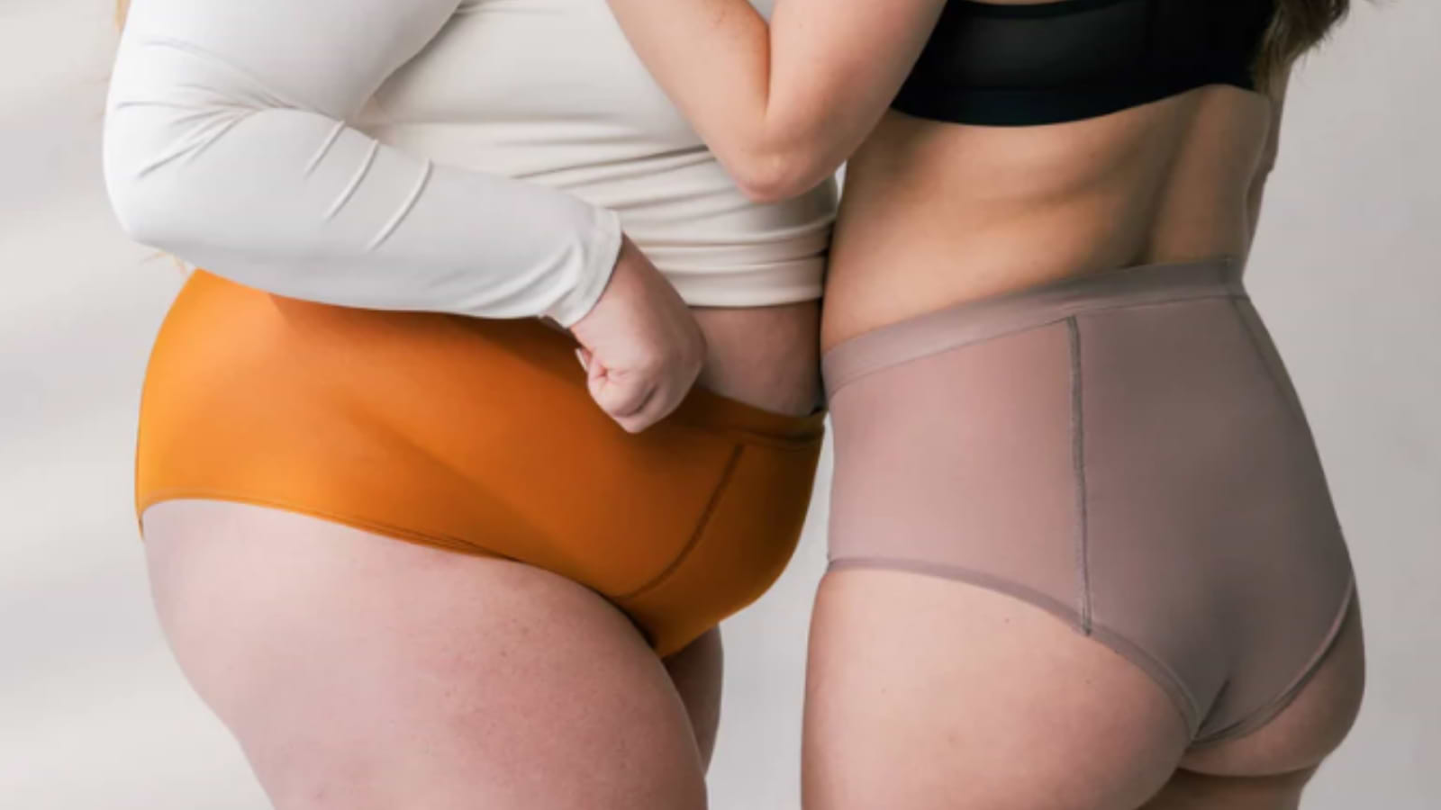 Two people modeling high-waisted underwear in different colors, shown from side and back angles.