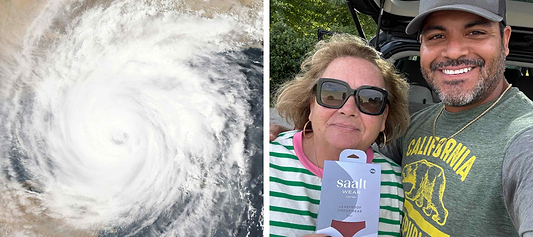Satellite image of a hurricane beside two smiling people holding Saalt leakproof underwear packaging outdoors.