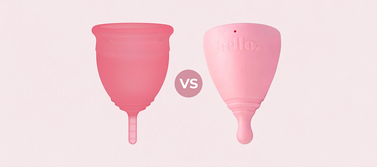 A dark pink menstrual cup next to a light pink cup with a vs icon between them on a pink background
