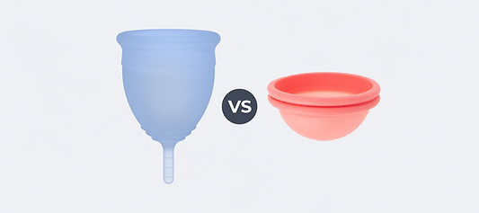 A blue menstrual cup next to a pink menstrual disc with a vs icon between them on a white background.
