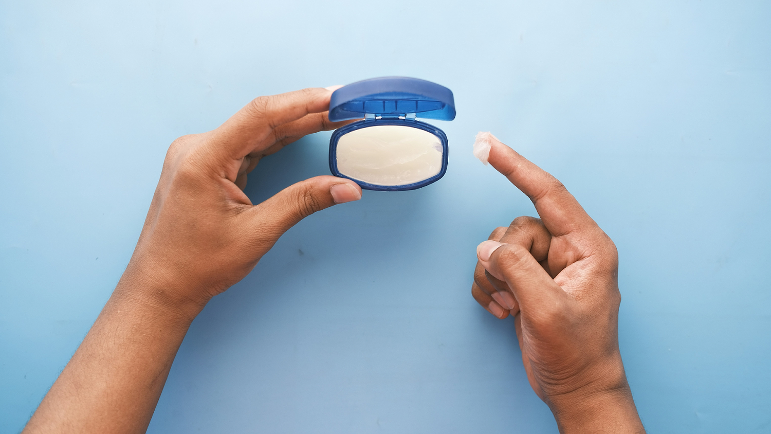 Woman Holding Vaseline Bottle