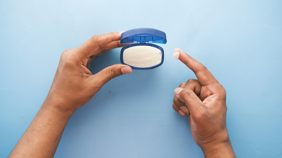 Woman Holding Vaseline Bottle