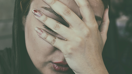 Woman Suffering From Nausea And Covering Her Face