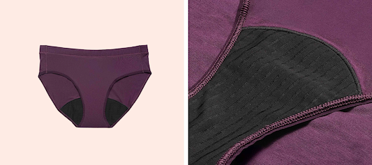 Purple period underwear with absorbent lining detail shown against a neutral background.