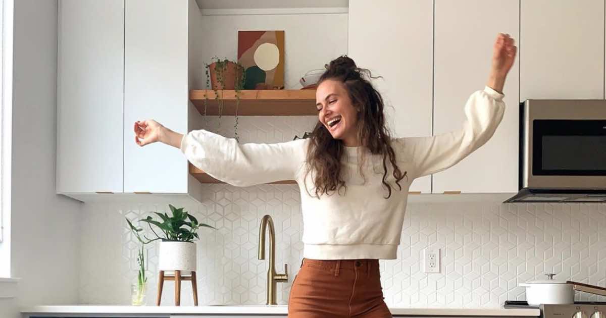 Kennedy Haffner jumping in her kitchen.
