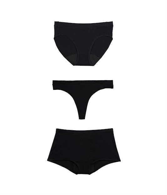 Three black women's underwear pieces on a white background
