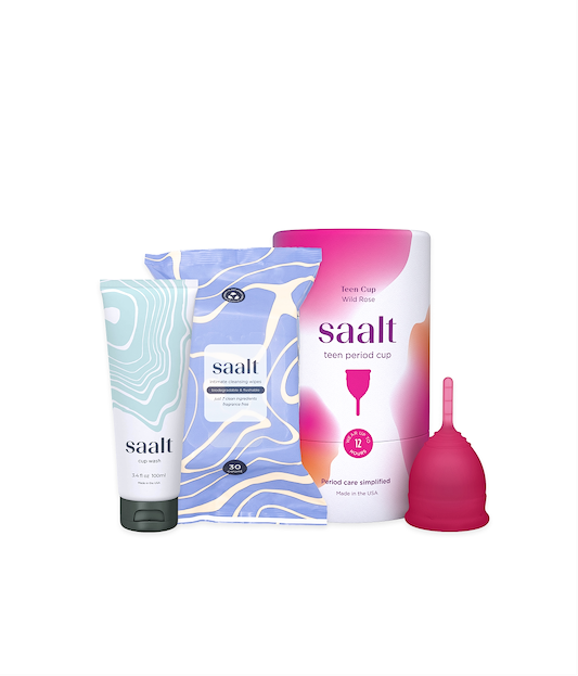 Menstrual care products including a tube, box, and pink menstrual cup with 'saalt' branding on a white background.
