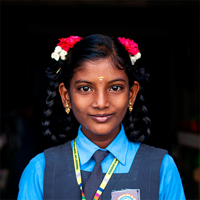 Indian female wearing blue under shirt with blue overalls on top
