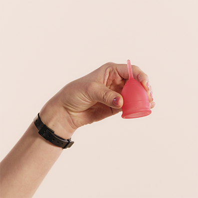 Female hand holding Saalt menstrual cup