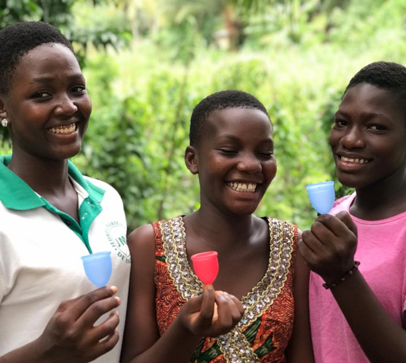 Three females holding the saalt cup product- impact 
