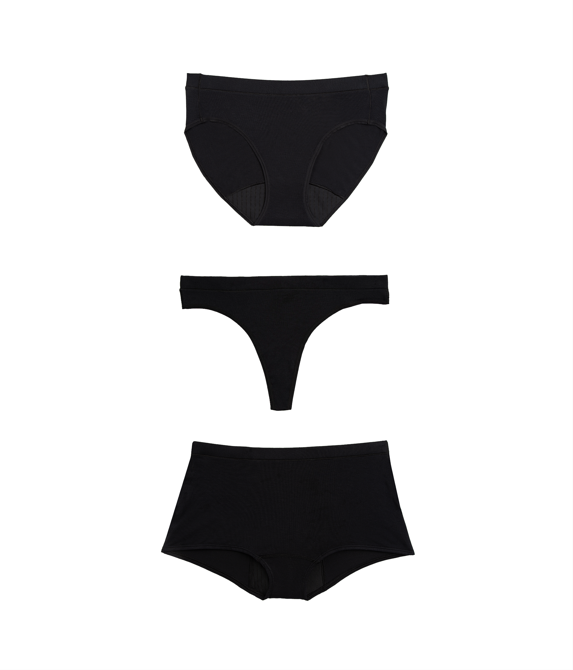 Three black women's underwear pieces on a white background