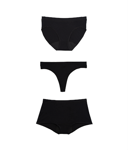 Three black women's underwear pieces on a white background