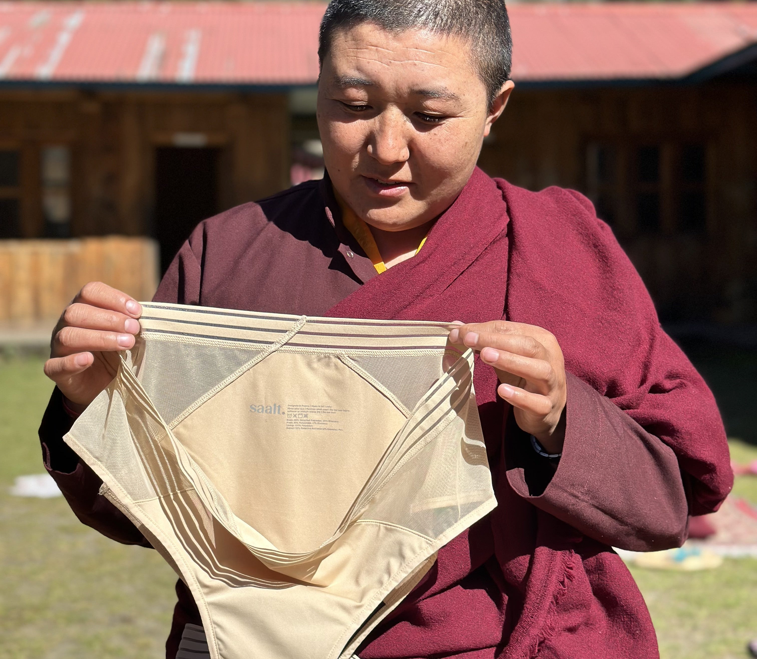 Serang Monastery Female holding skin tone colored period underwear