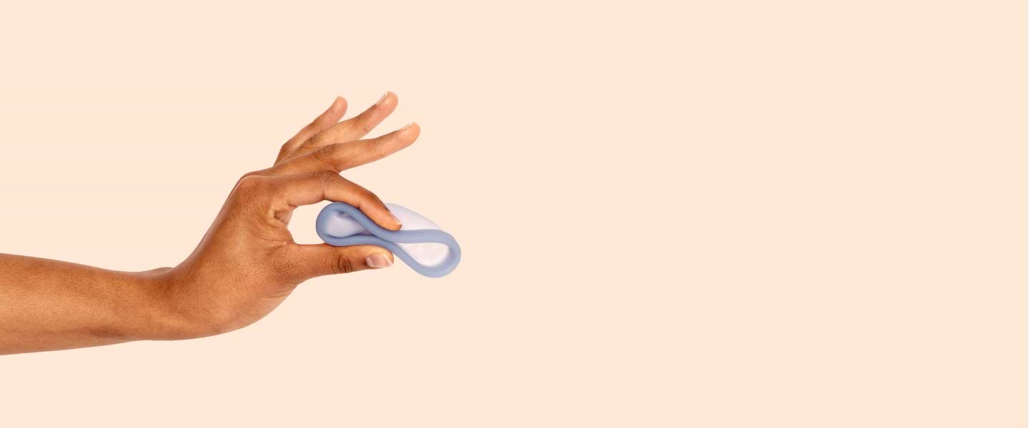 female hand pinching saalt disc