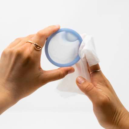 female hands cleaning saalt disc