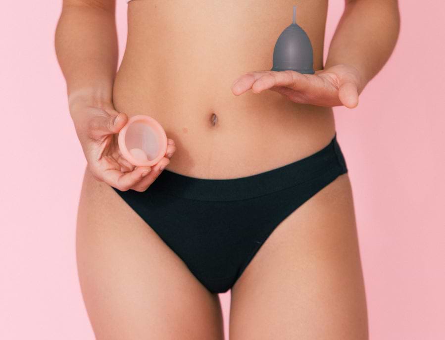 Female holding Saalt Cup and Disc