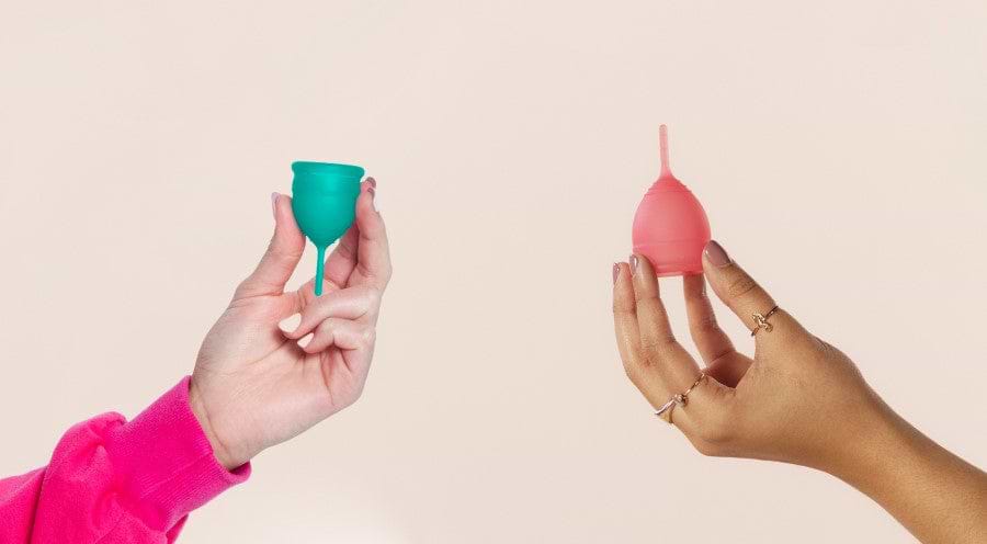 Freedom from the Tampon isle banner. Female hands holding Saalt Cups