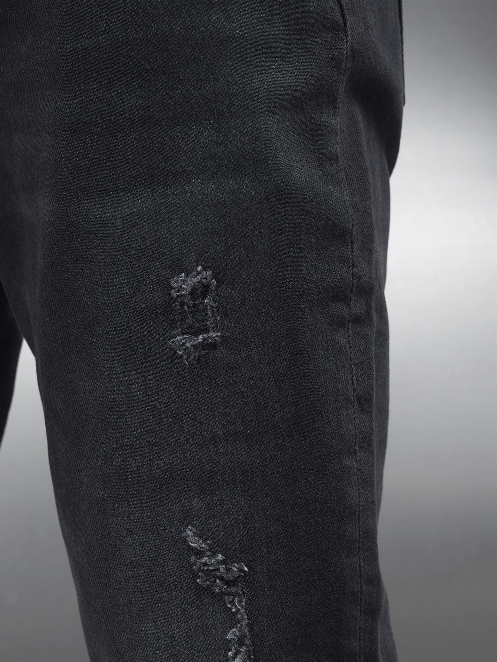 Distressed Slim Fit Denim Jeans in Black Wash
