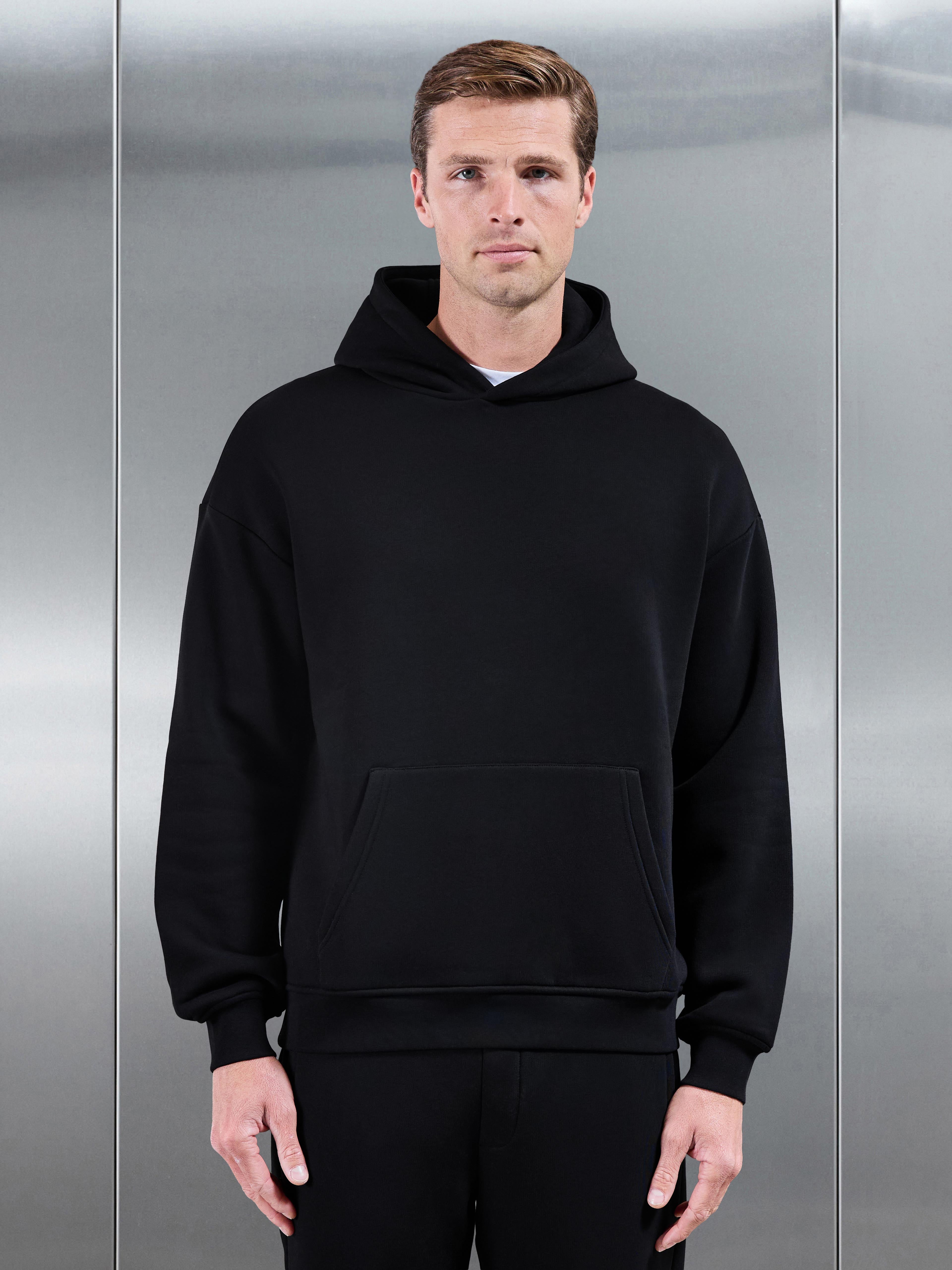 Essential Relaxed Hoodie in Black