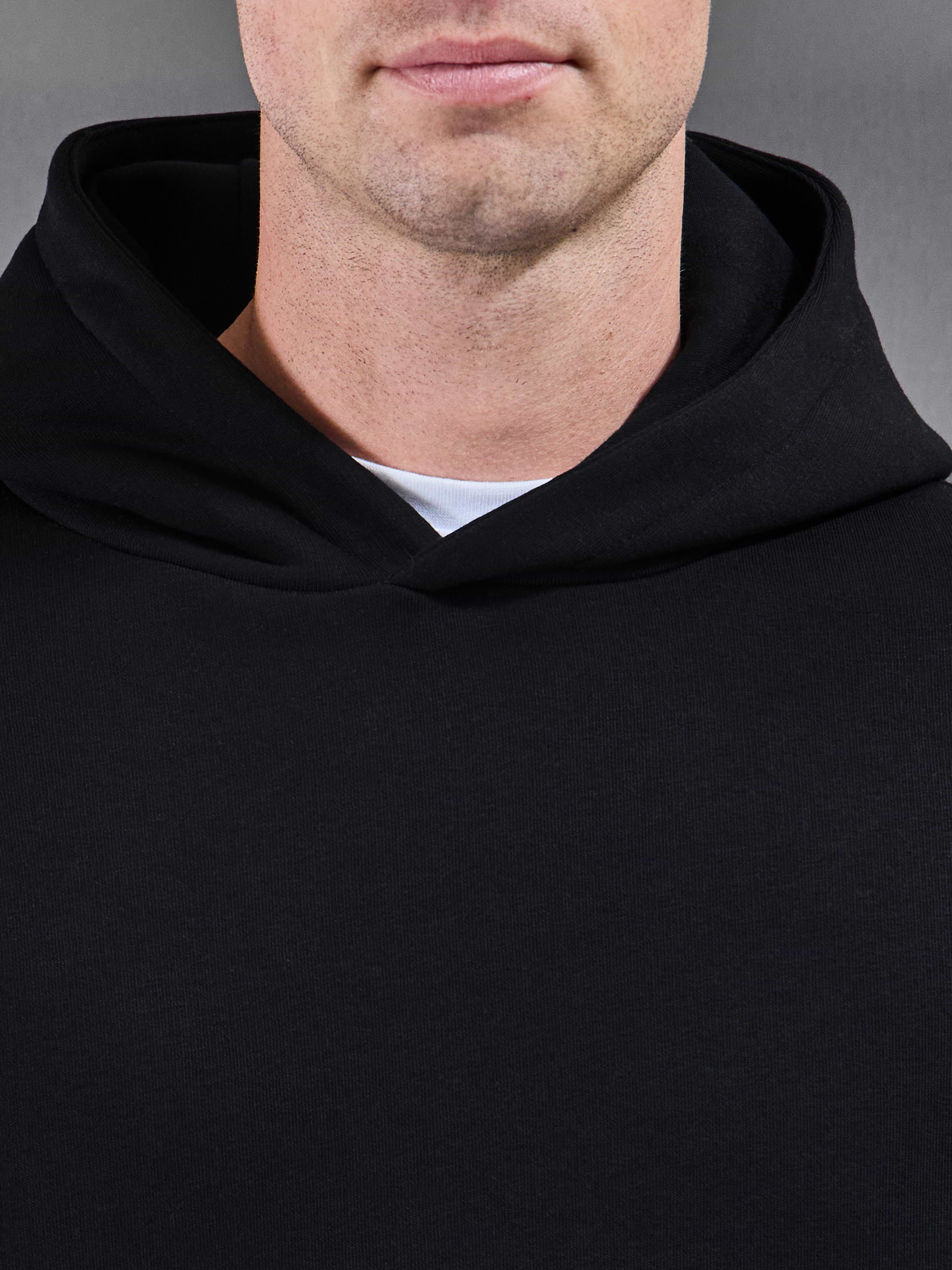 Essential Relaxed Hoodie in Black