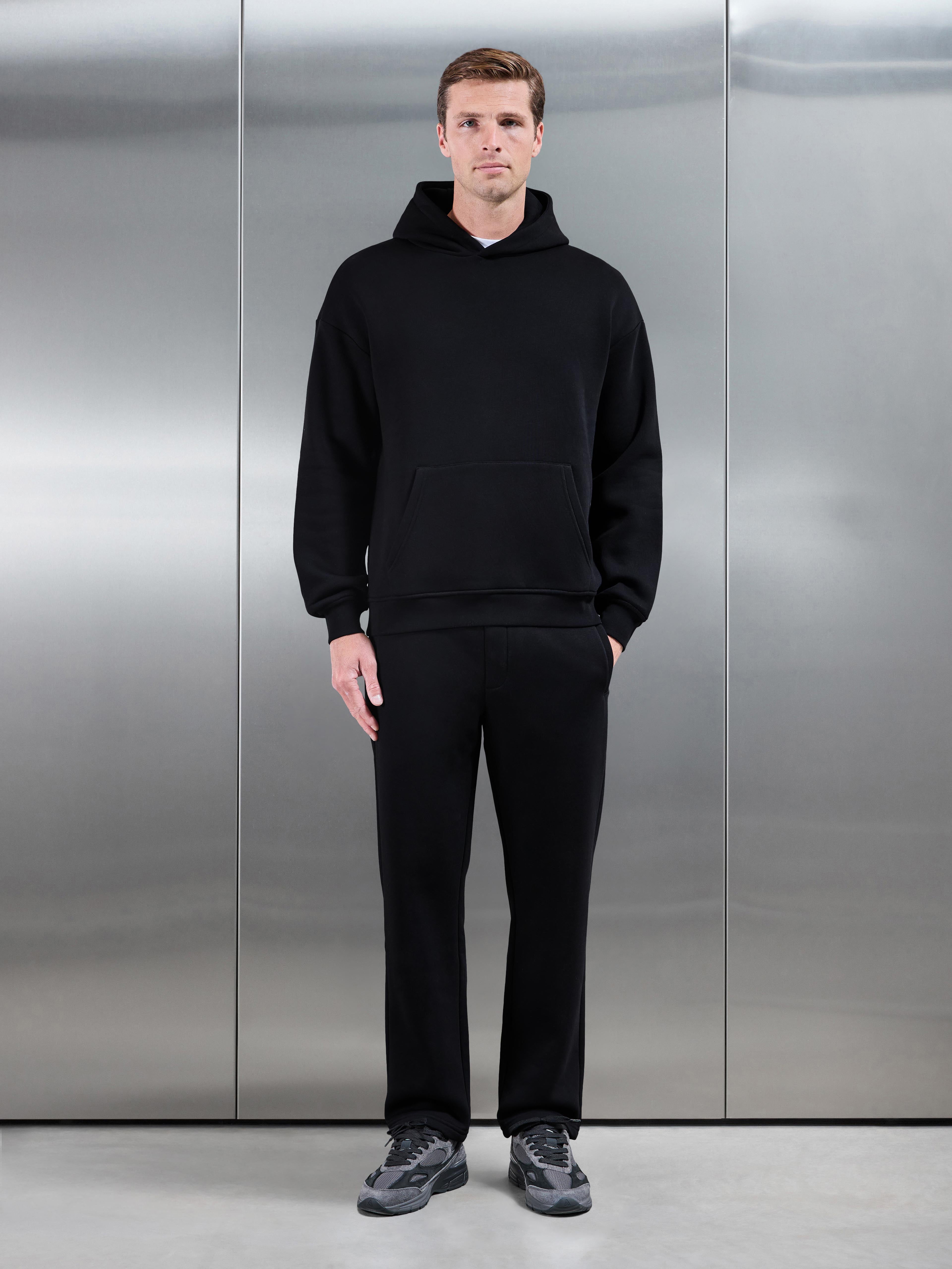 Essential Relaxed Hoodie in Black