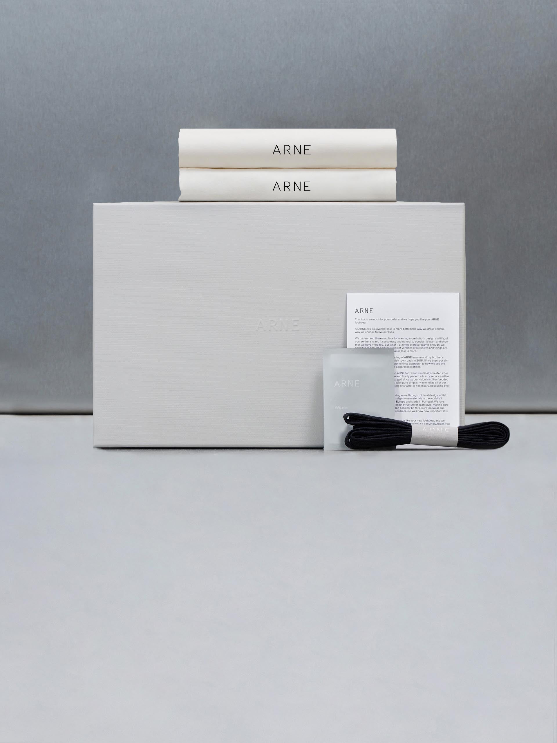 Mid Essential Leather Trainer in Black