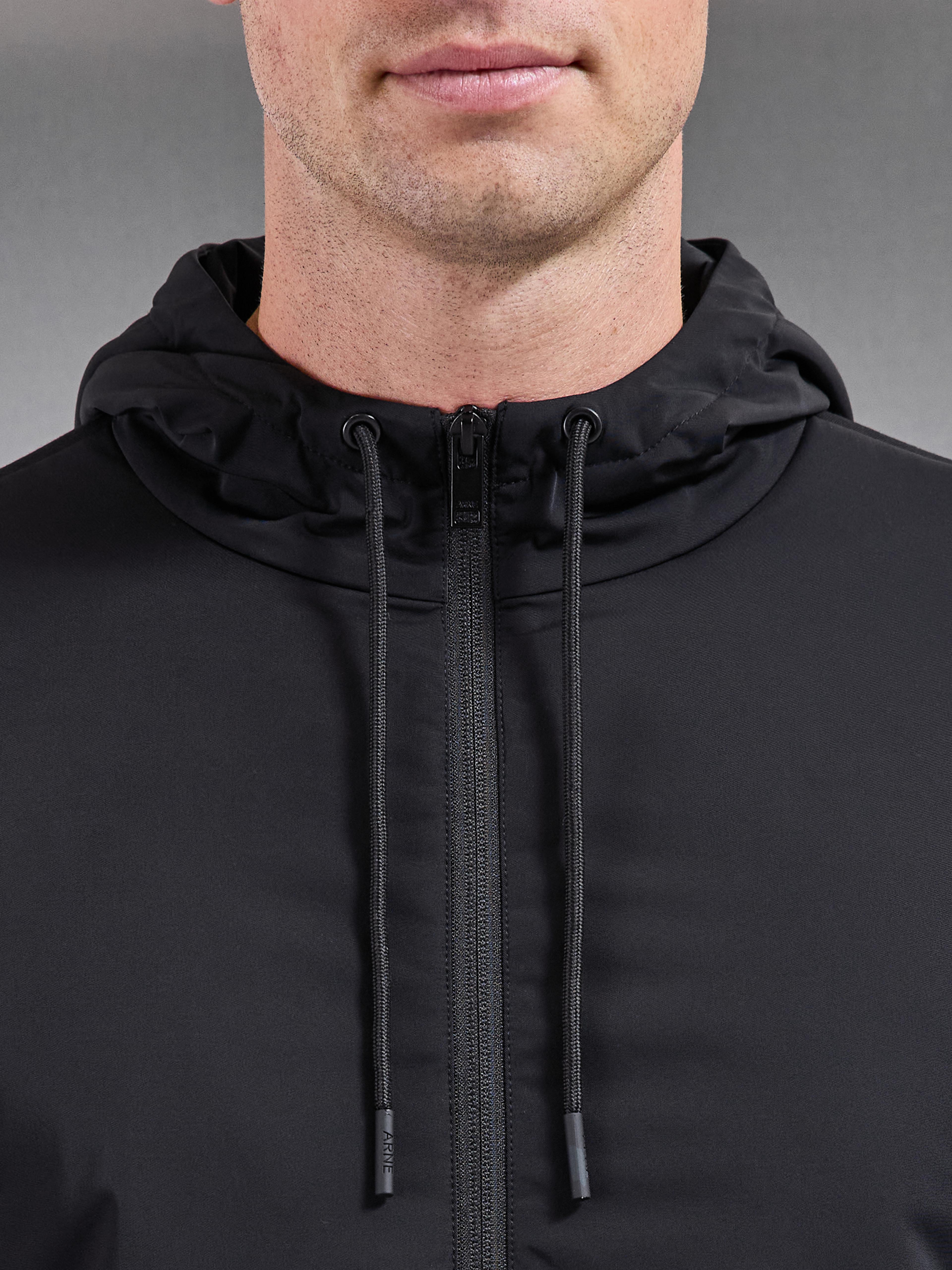 Interlock Jersey Hybrid Technical Windbreaker in Black