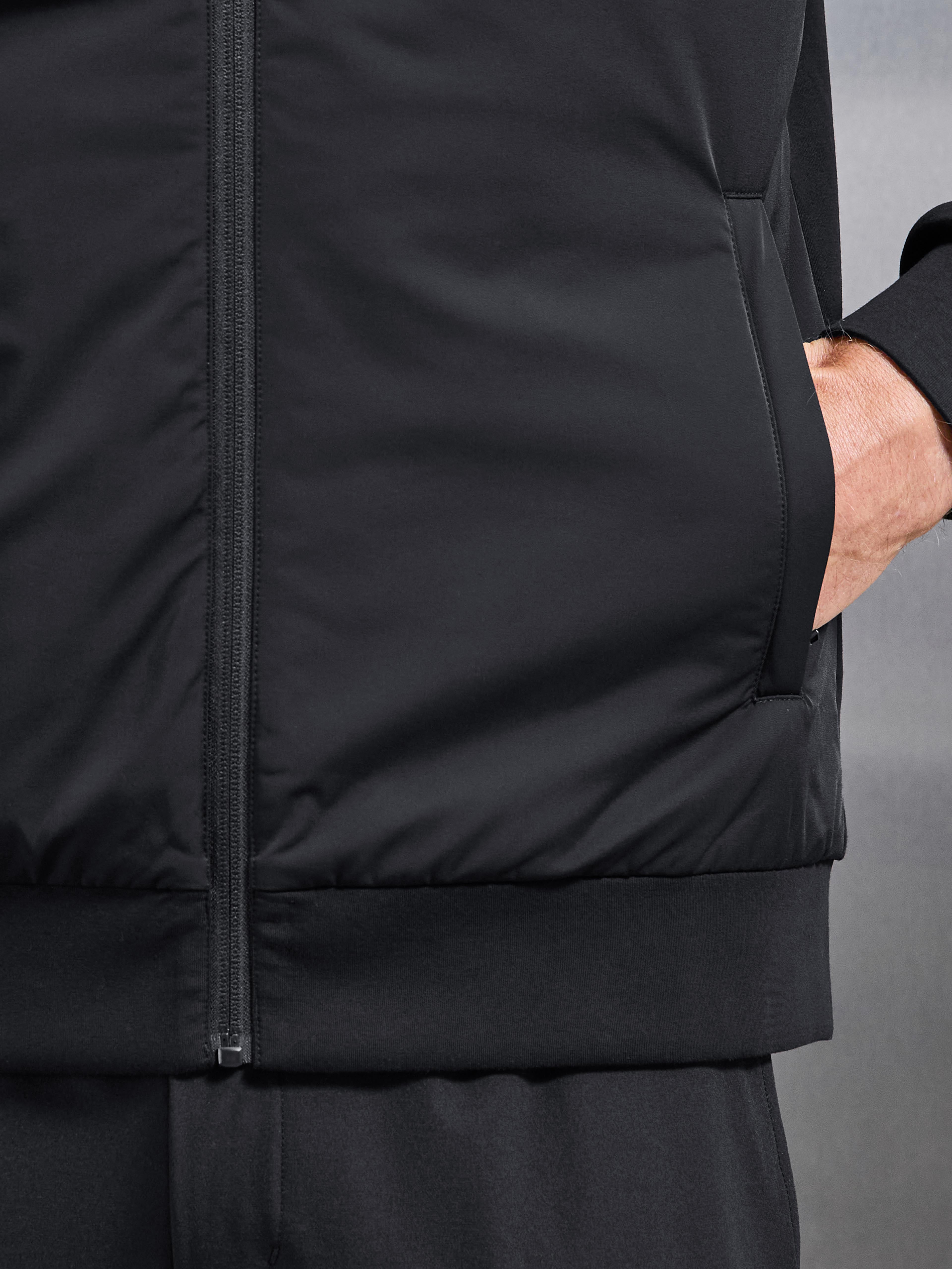 Interlock Jersey Hybrid Technical Windbreaker in Black
