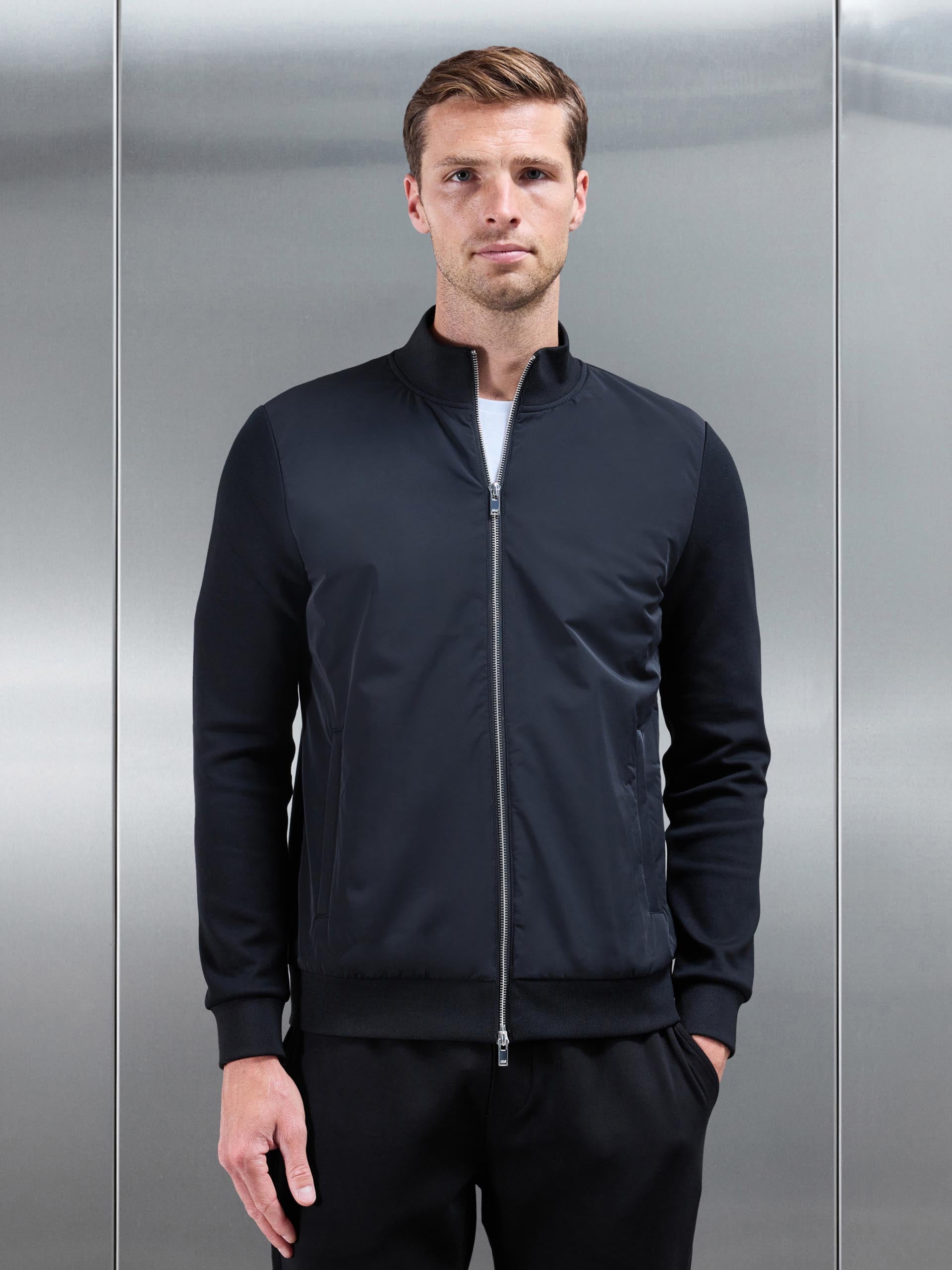Interlock Jersey Hybrid Funnel Neck Jacket in Black