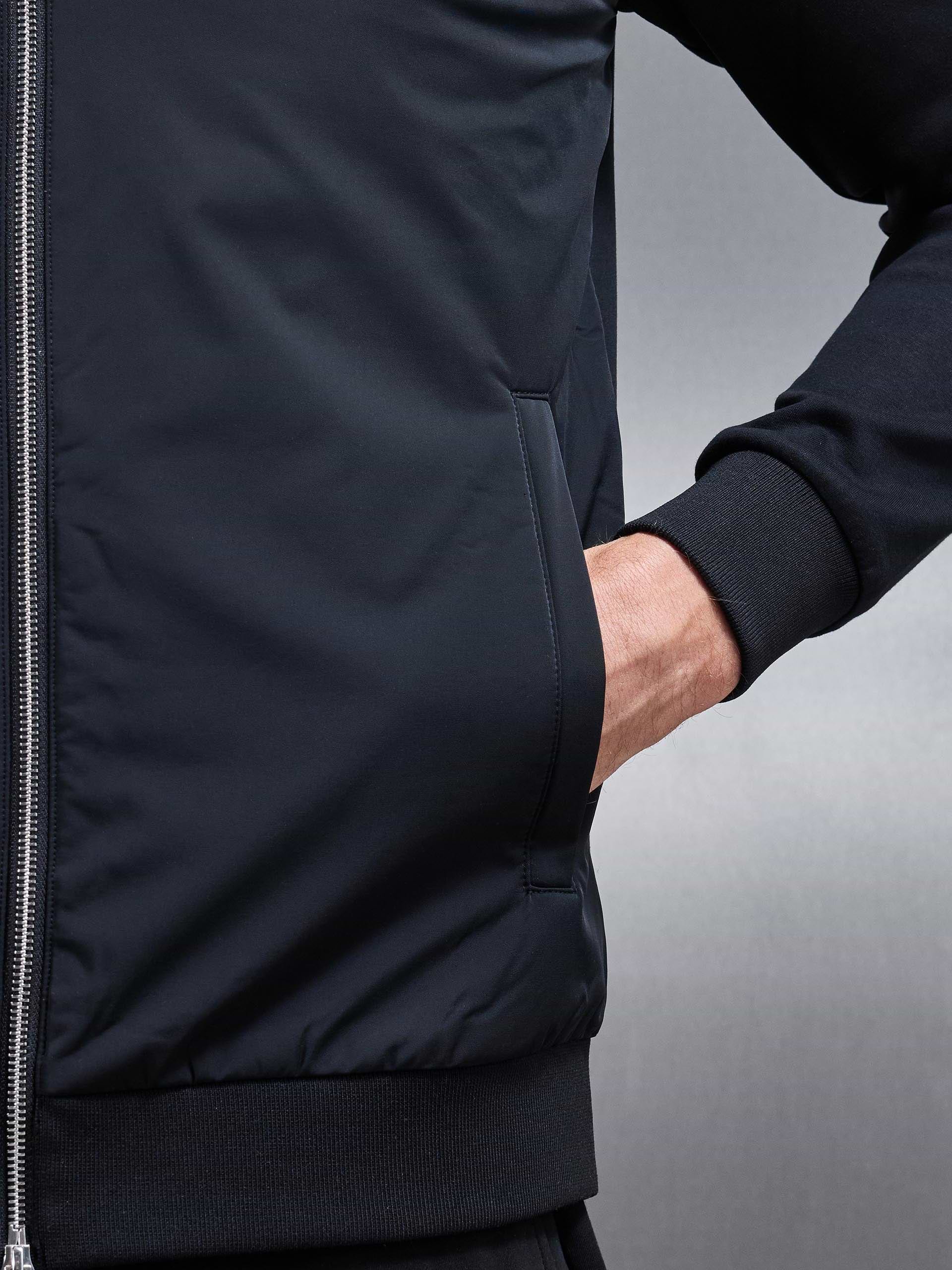Interlock Jersey Hybrid Funnel Neck Jacket in Black
