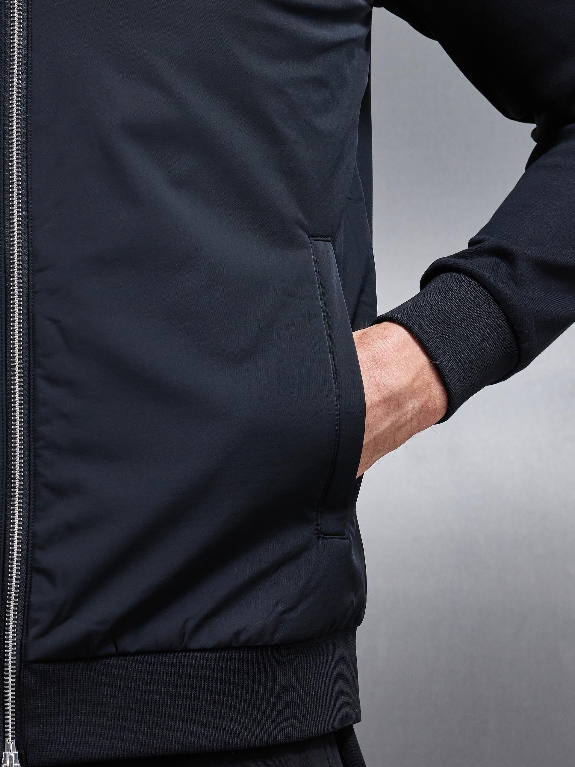 Interlock Jersey Hybrid Funnel Neck Jacket in Black