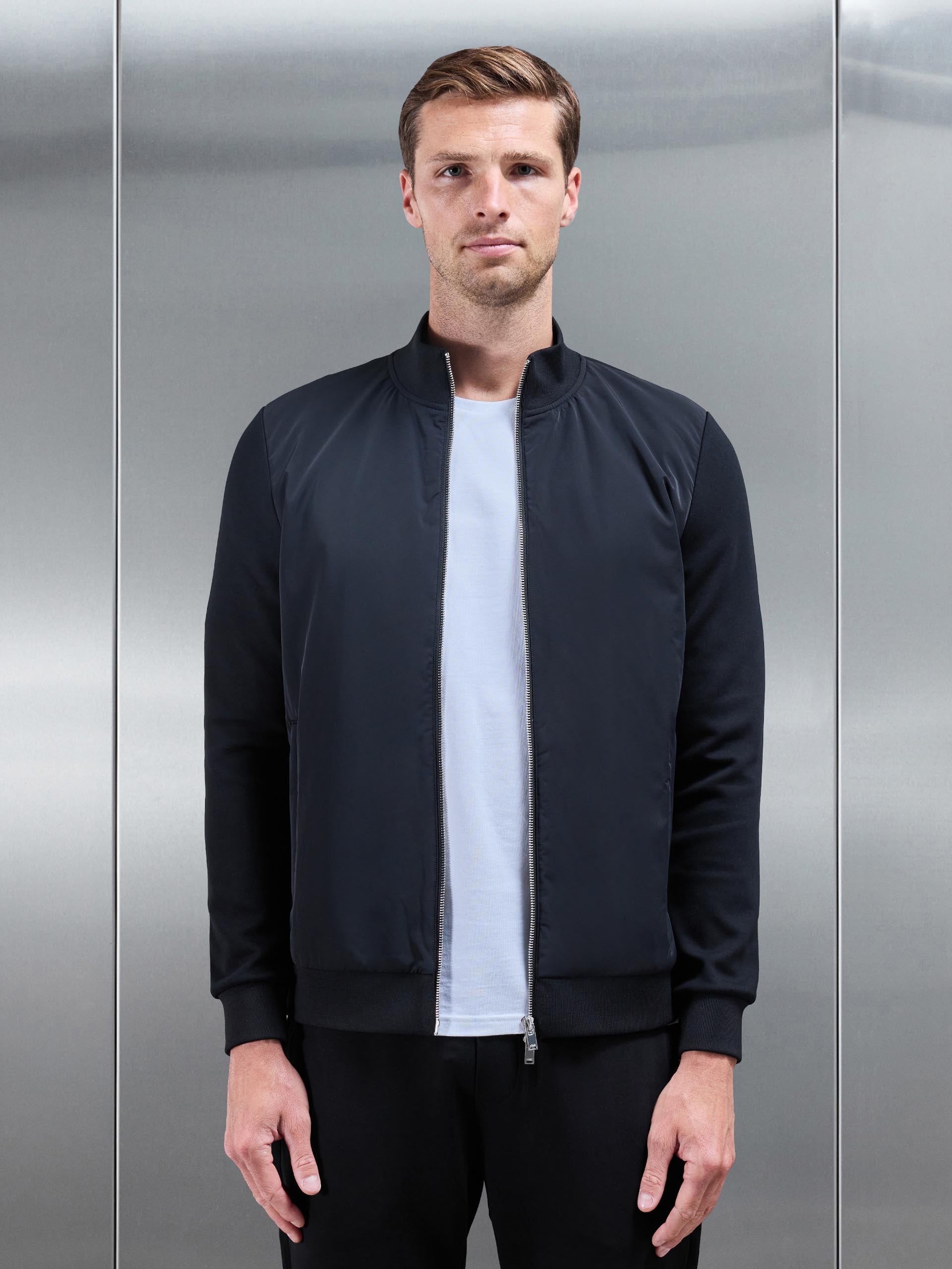 Interlock Jersey Hybrid Funnel Neck Jacket in Black