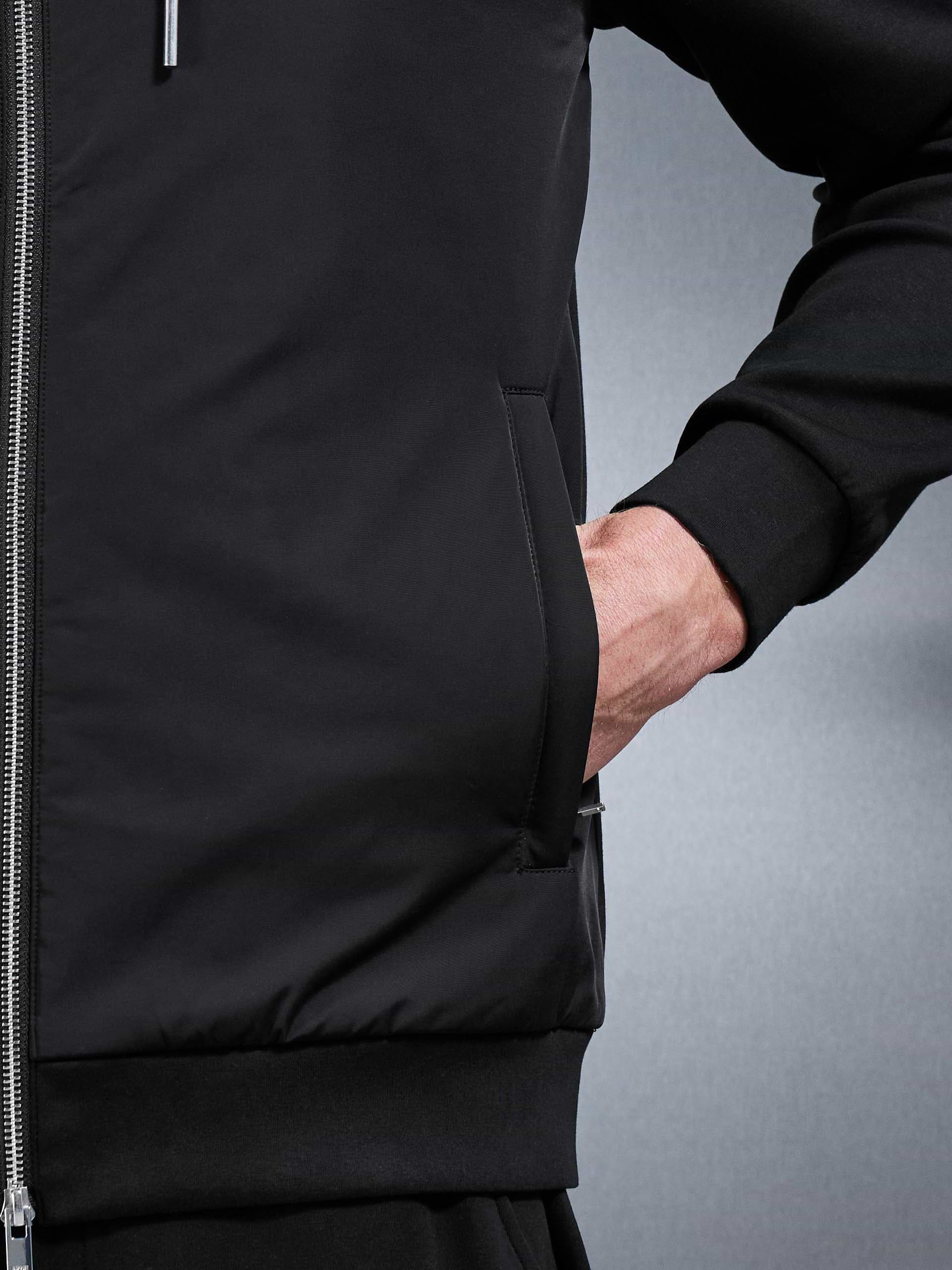 Interlock Jersey Hybrid Windbreaker in Black