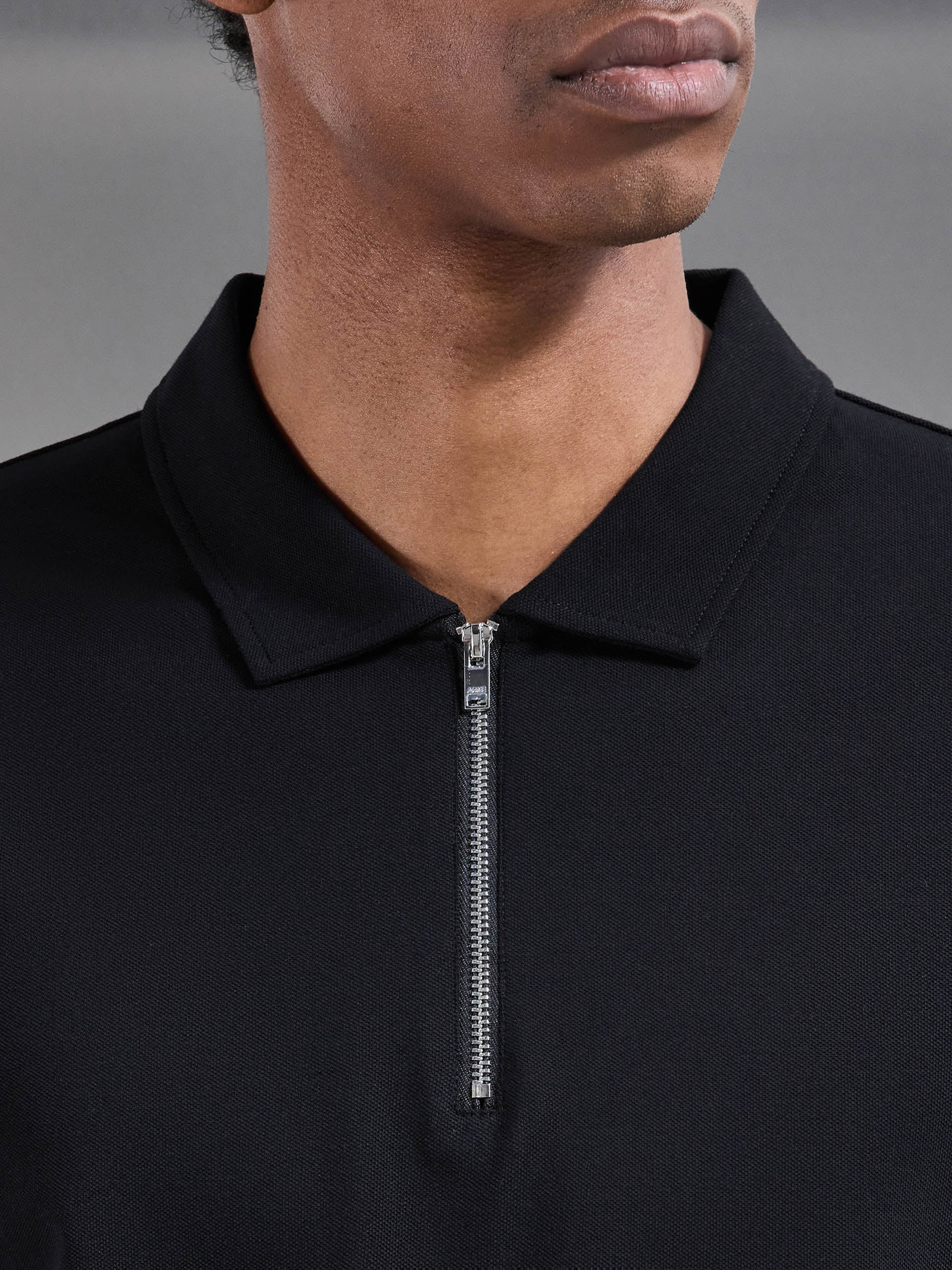 Mercerised Pique Zip Polo Shirt in Black | ARNE UK