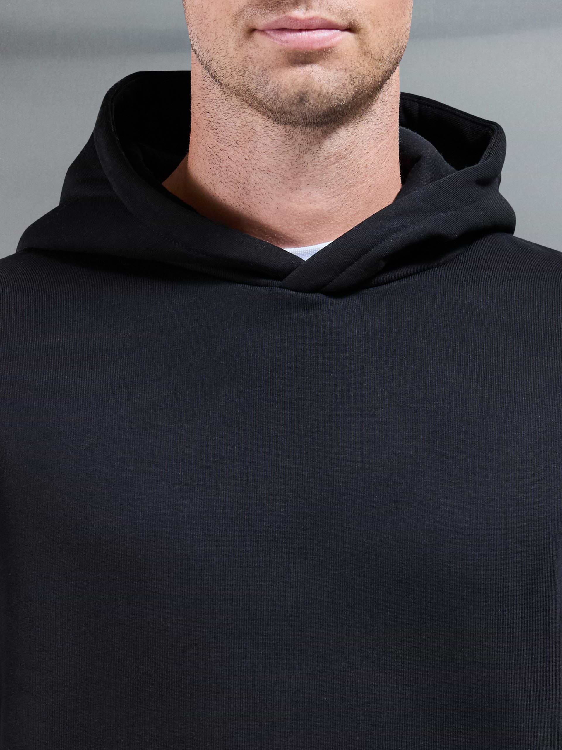 Essential Relaxed Hoodie in Black