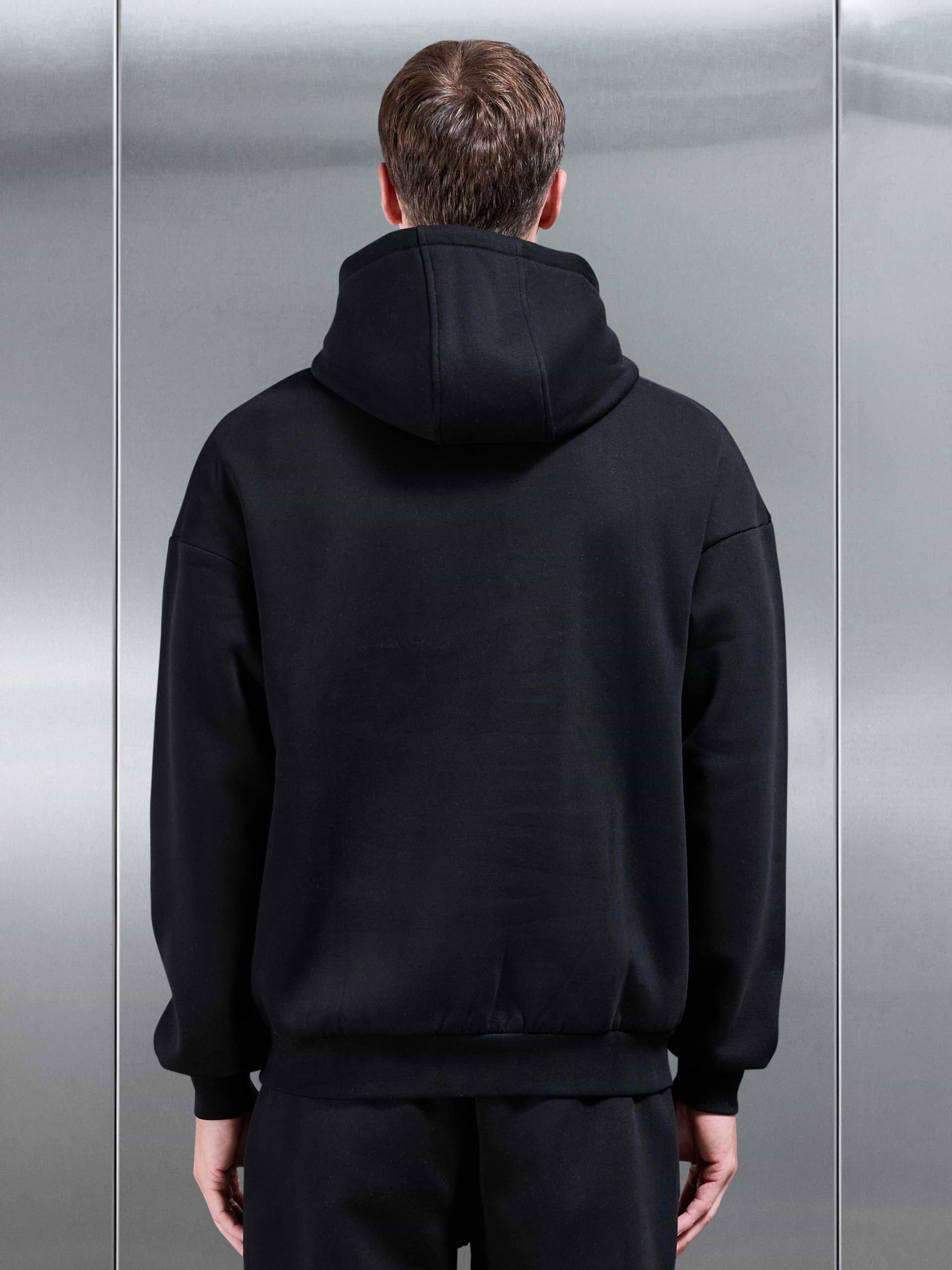 Essential Relaxed Hoodie in Black