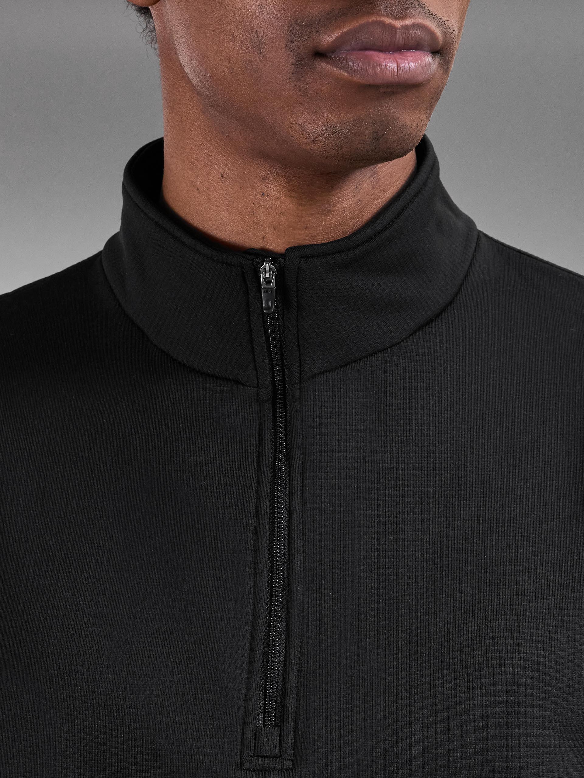 Mens Insulating Golf Mid Layer in Black