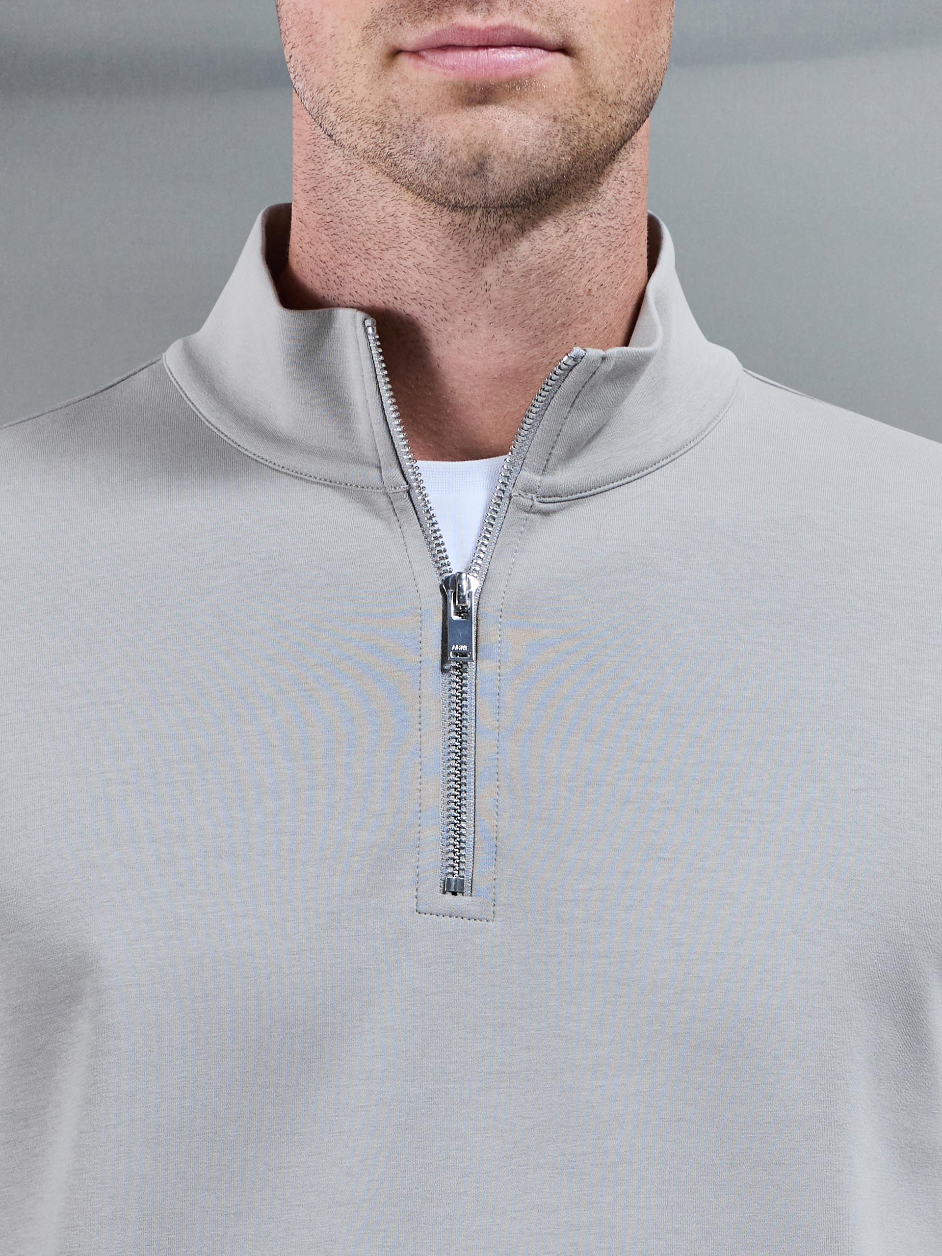 Mens Interlock Jersey Half Zip in Stone