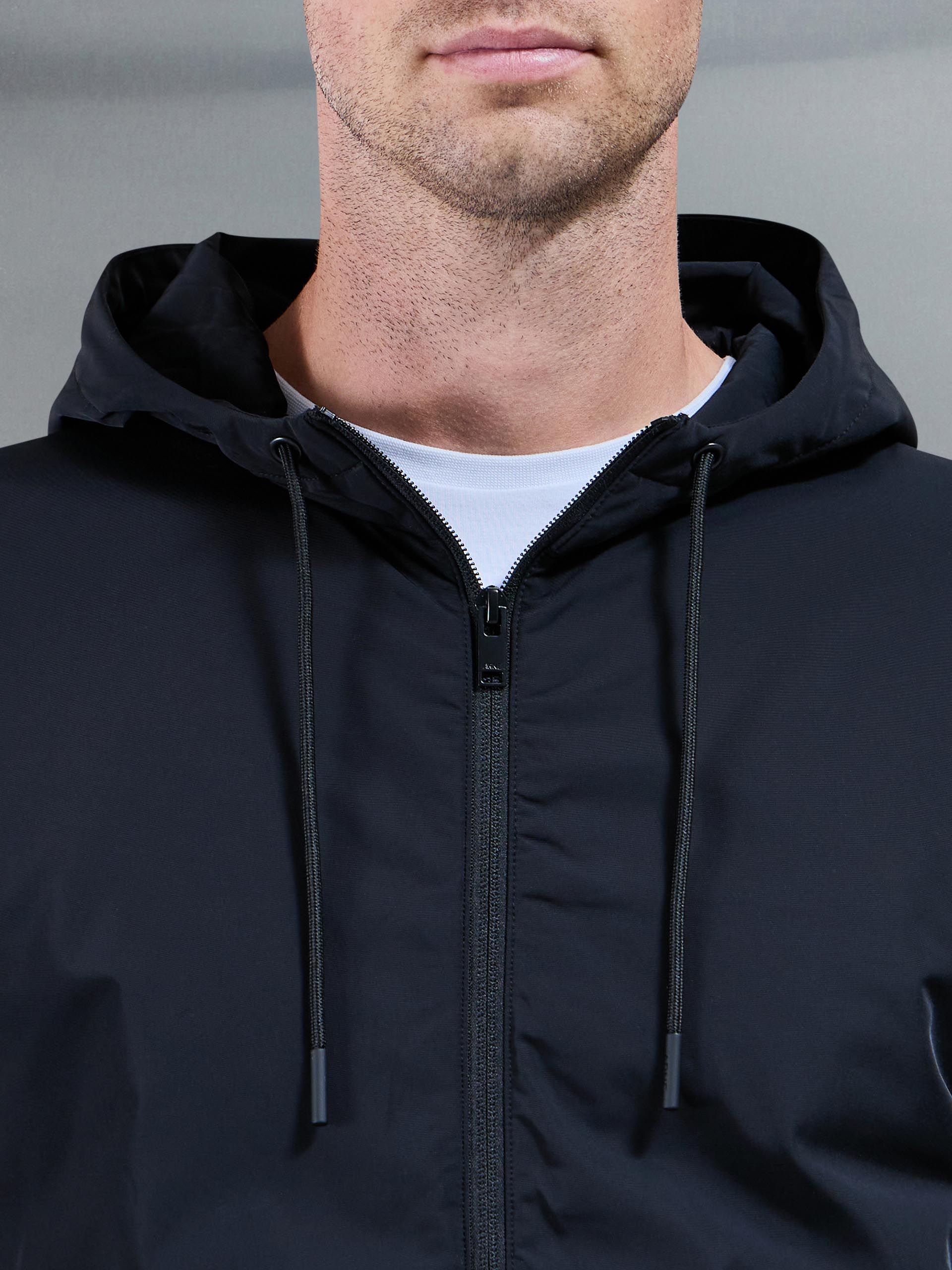 Mens Interlock Jersey Hybrid Technical Windbreaker in Black