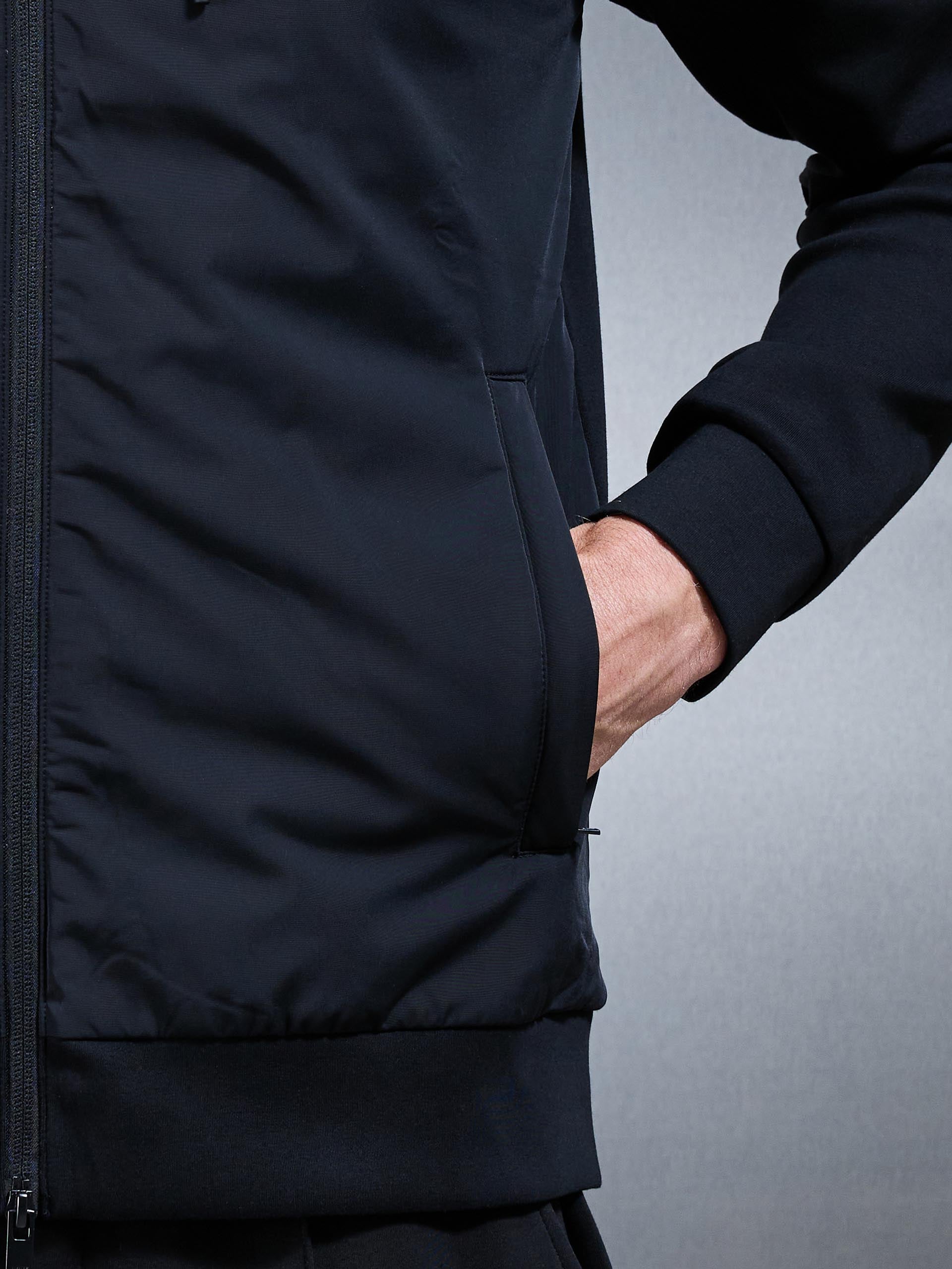 Mens Interlock Jersey Hybrid Technical Windbreaker in Black