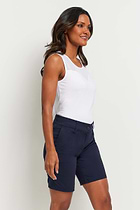 The Best Travel Short. Woman Showing the Side Profile of a Breck Performance Cotton Short in Navy.