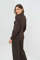 Front view of olive green jacket featuring  knitted back and side.